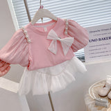 Girls Modern Princess 2Pc Puff Sleeve Top & Puff Skirt Set. Adorned With Bow and Streamer Pearl Shoulder accents.